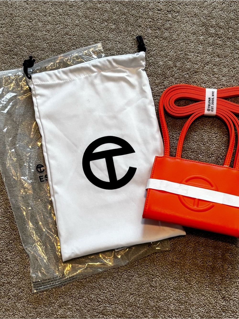 Telfar small unisex shopping bag bright.  orange, brand new dust bag crossbody